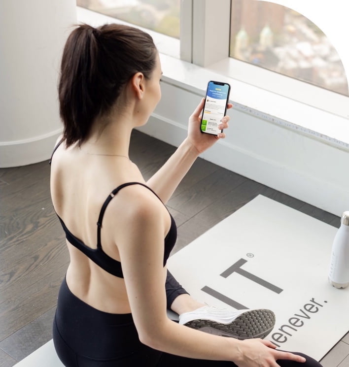 Woman using the new Connected Training feature during a workout