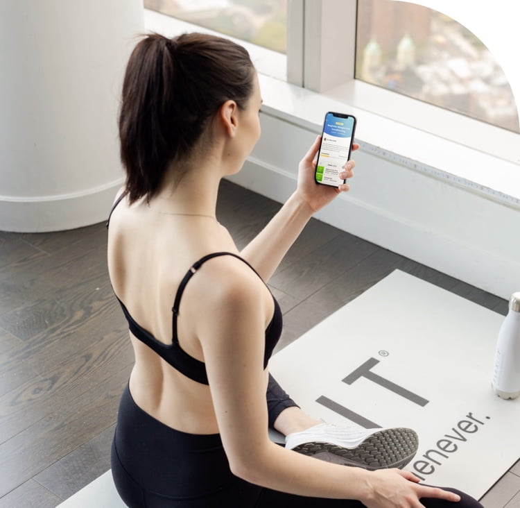 Woman using the new Connected Training feature during a workout