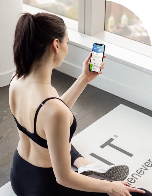 Woman using the new Connected Training feature during a workout